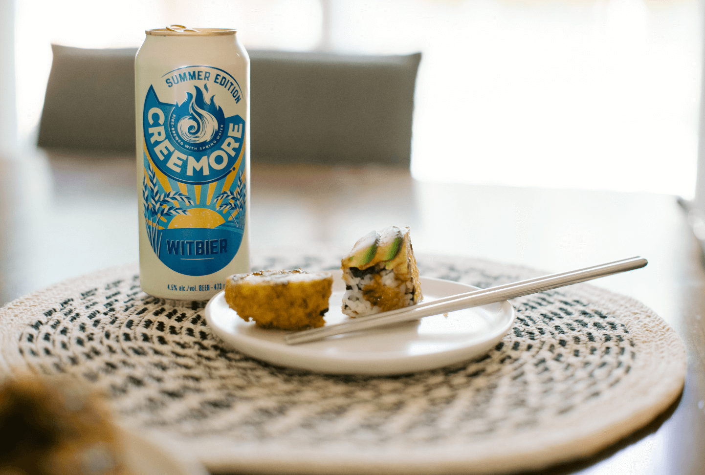 witbier can with a dish with sushi