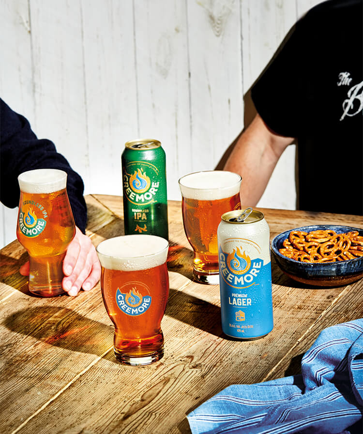 table with creemore cans and snacks