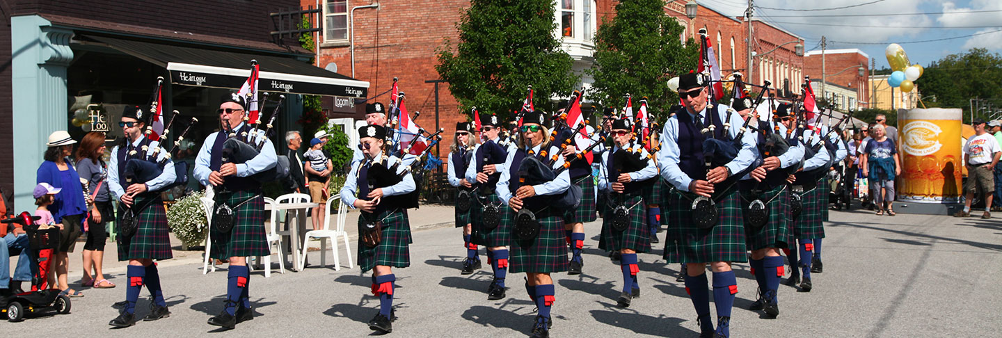 people playing pipers on the street