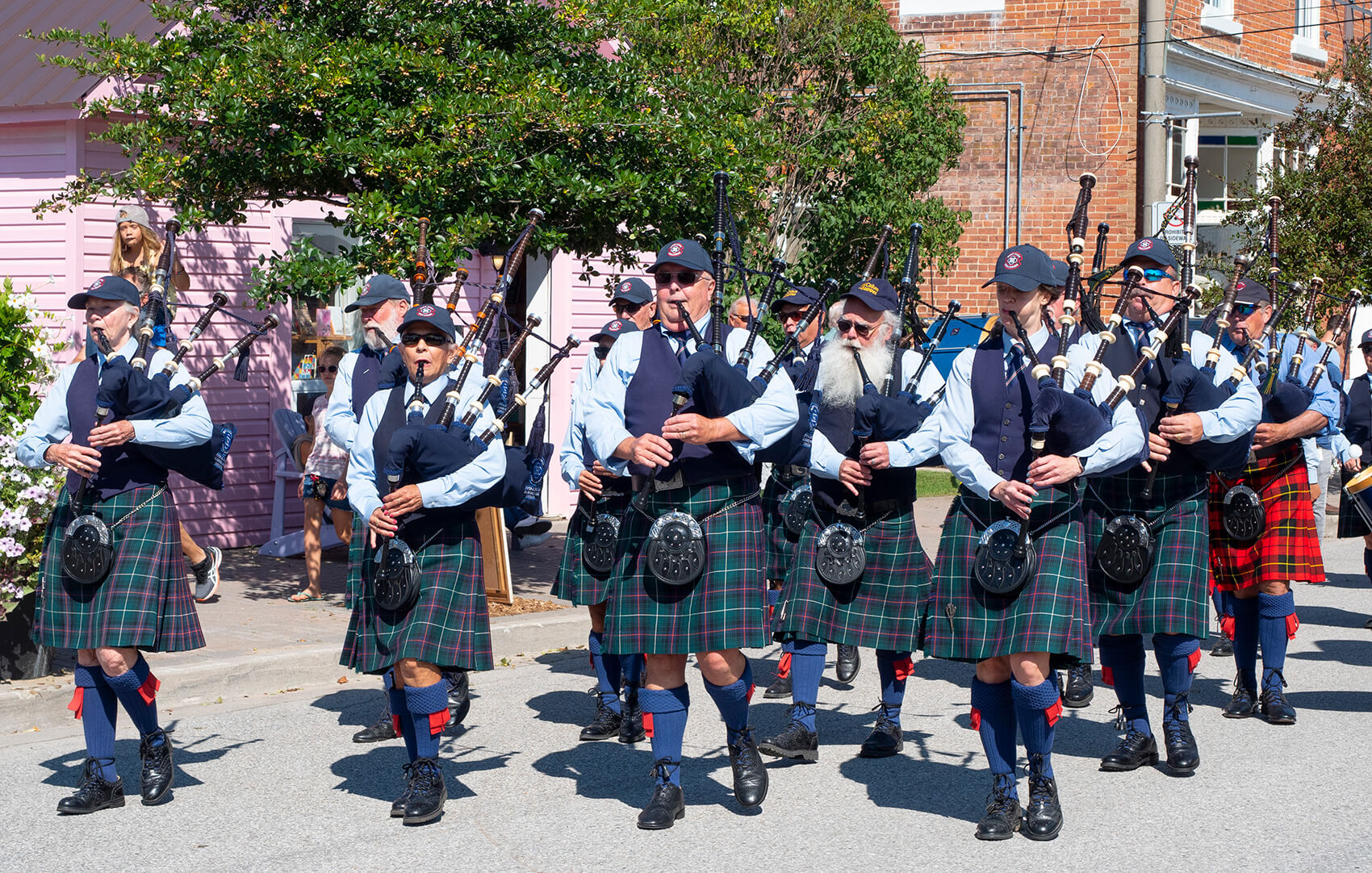 people playing pipers on the street