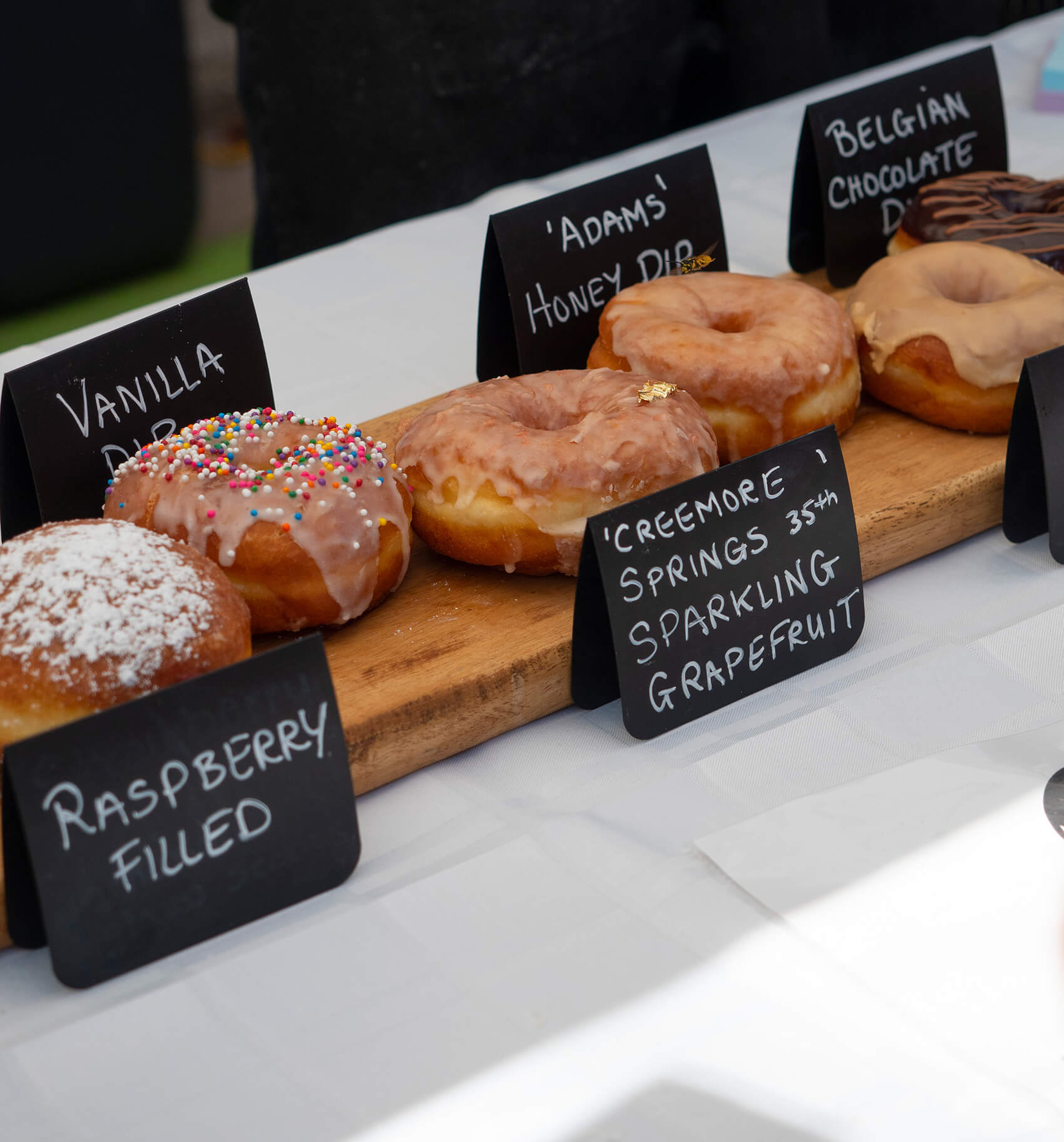 donuts and pastries with signs